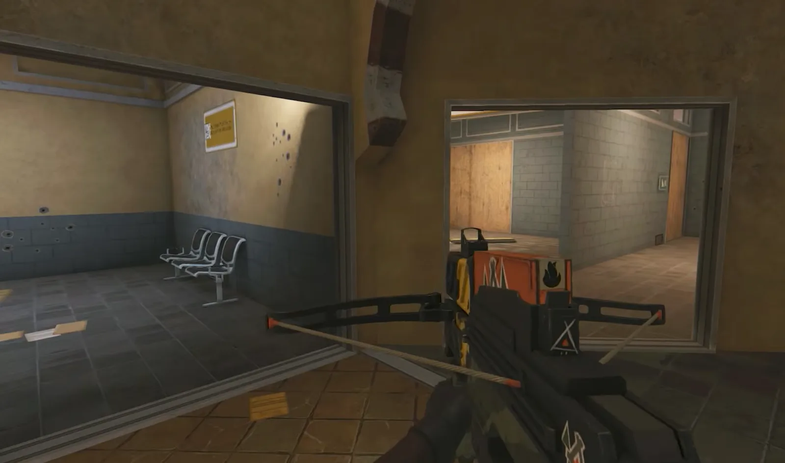 A Rainbow Six Mobile round in progress, the operator holding an angle through a doorway into a bomb-site room