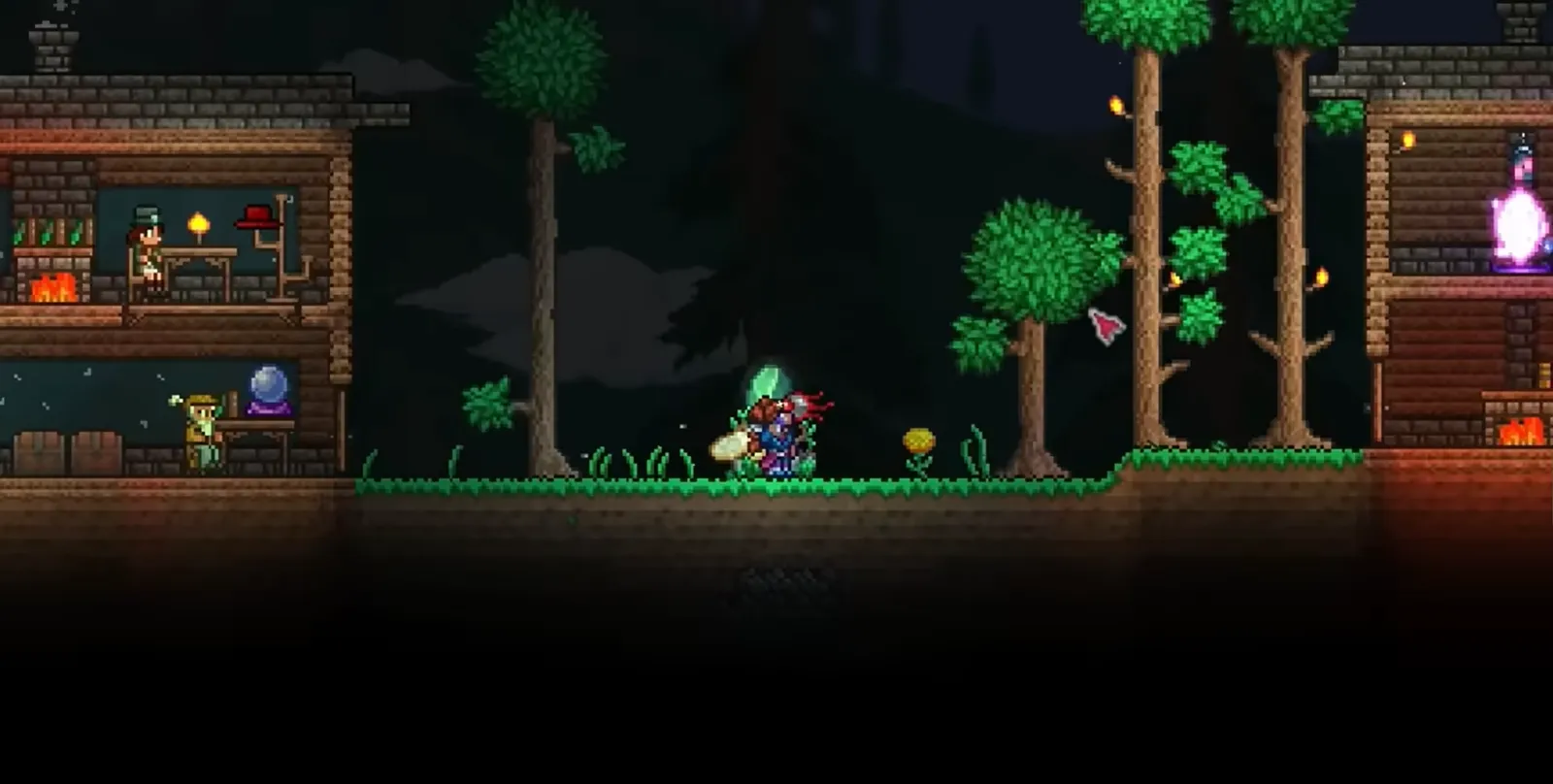 A Terraria surface base at night, lit NPC rooms either side of the player standing among trees