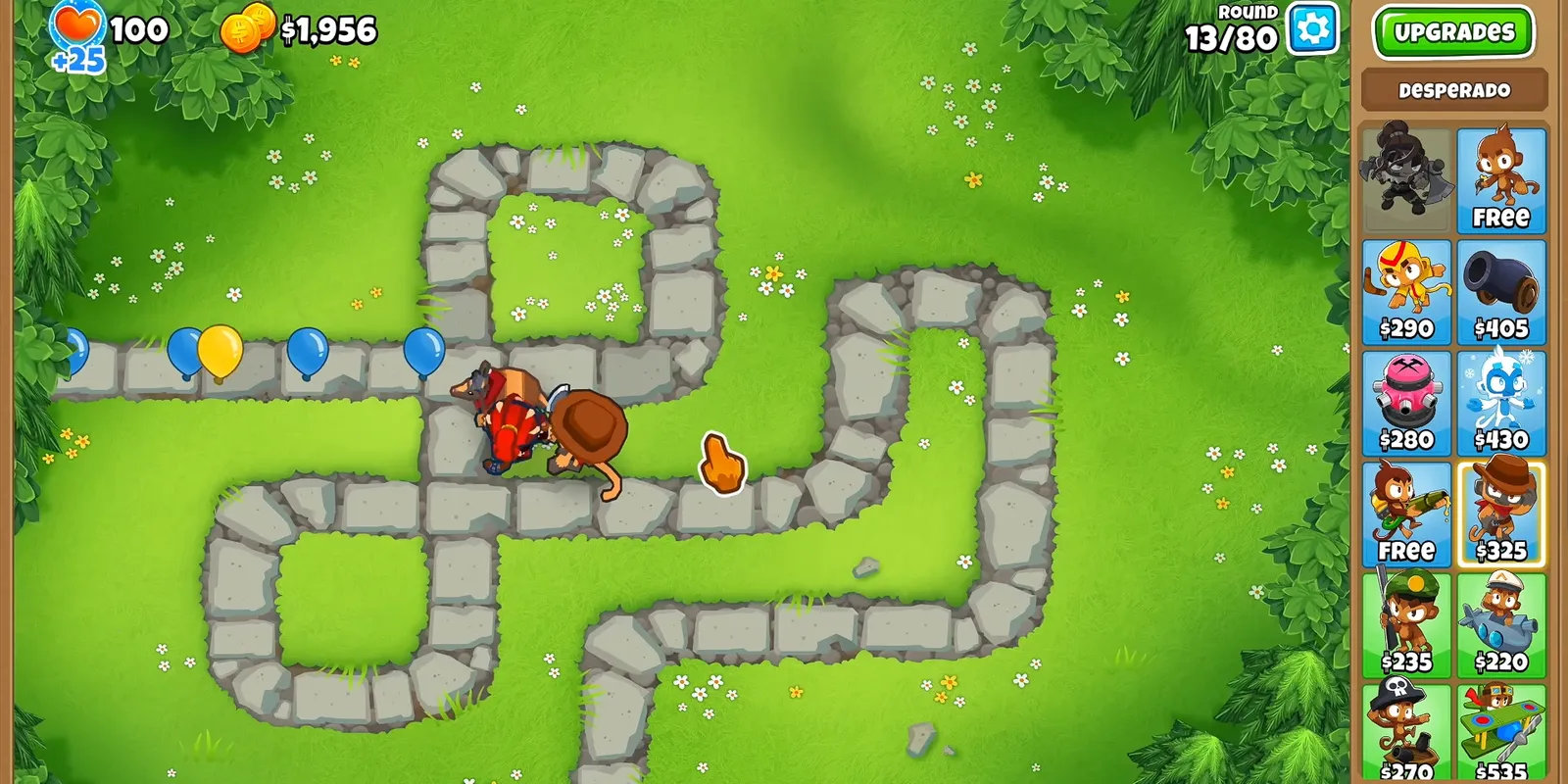 A Bloons TD 6 round in progress, balloons entering a green track with the monkey shop open on the right