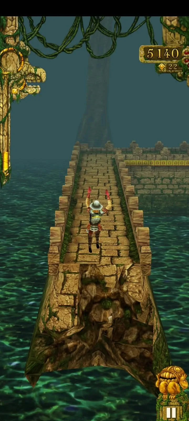 A Temple Run sprint along a narrow stone path over water, the score and coin counter in the top corner