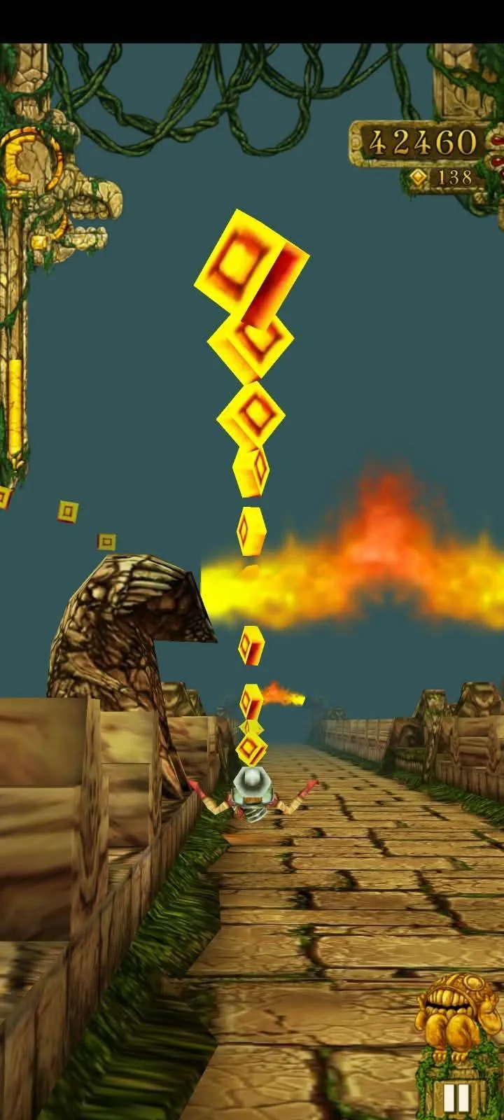 A fire jet erupting across the Temple Run track as the runner banks past a line of coins